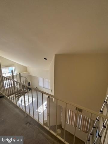 stairs with lofted ceiling