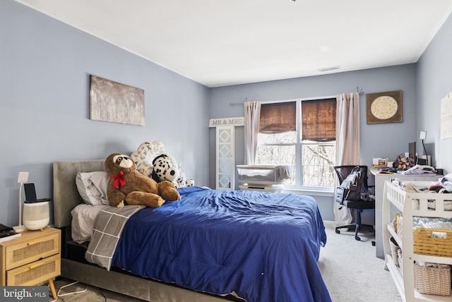 carpeted bedroom with visible vents