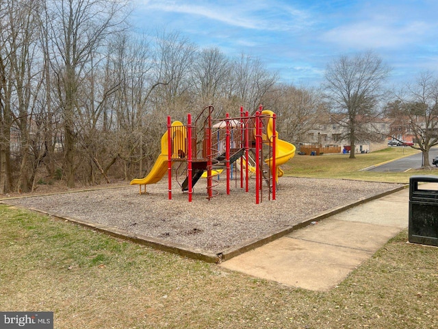 community jungle gym with a yard