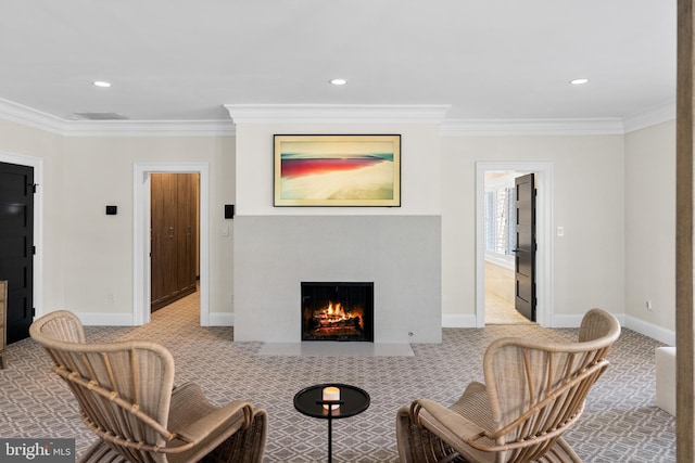 sitting room with carpet and ornamental molding