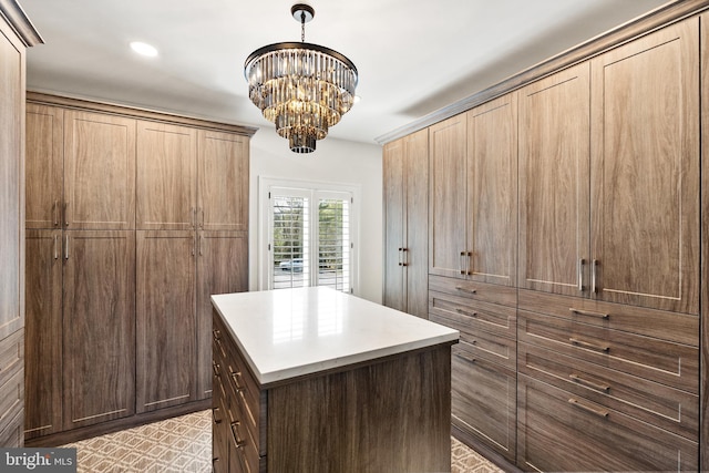 spacious closet with a chandelier