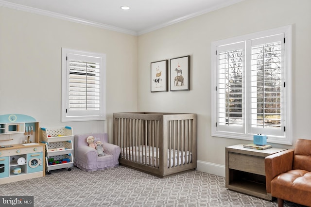 carpeted bedroom featuring baseboards and crown molding