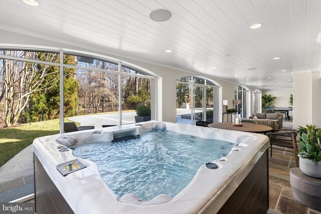 exterior space with wooden ceiling and a jacuzzi