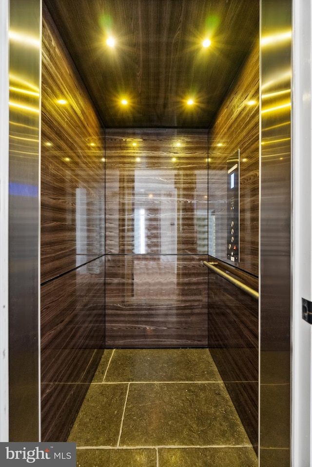 interior details with recessed lighting and elevator