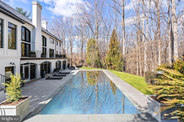 pool with a patio