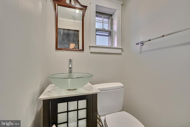 bathroom with toilet and vanity