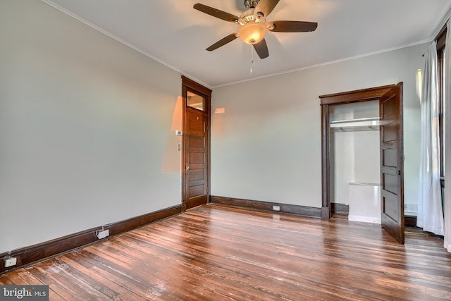 unfurnished bedroom with a ceiling fan, baseboards, ornamental molding, a closet, and dark wood-style floors