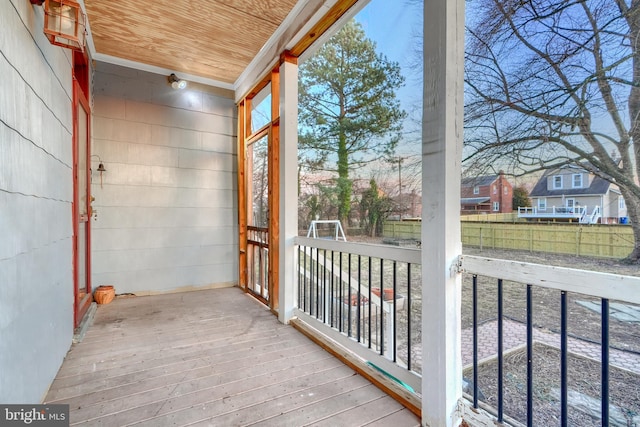 unfurnished sunroom featuring wooden ceiling