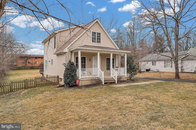 bungalow-style house featuring a shingled roof, fence, a porch, and a front yard