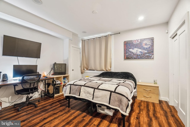 bedroom featuring wood finished floors and recessed lighting