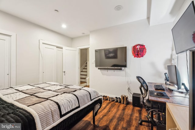 bedroom with recessed lighting and wood finished floors