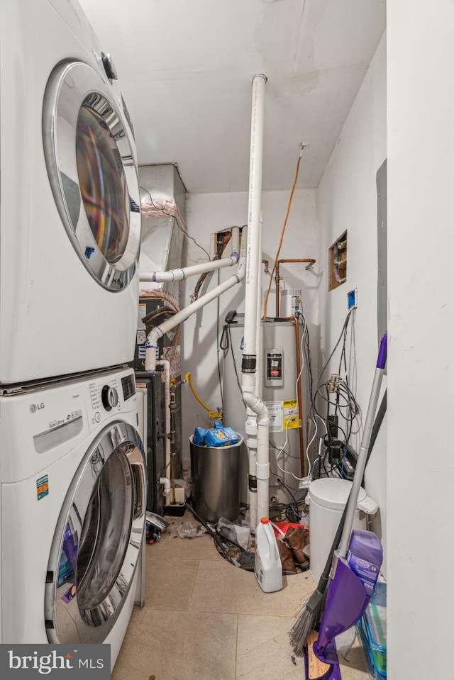 laundry room featuring laundry area and stacked washer and clothes dryer