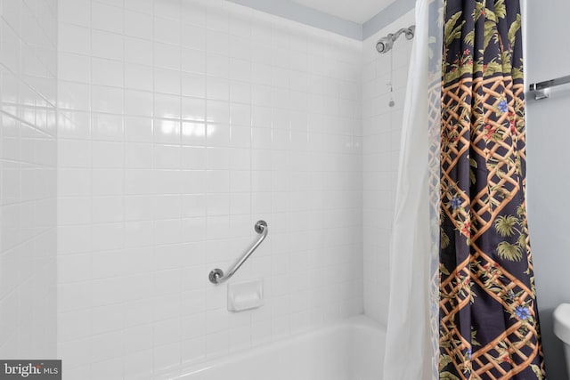 bathroom with shower / bathtub combination with curtain