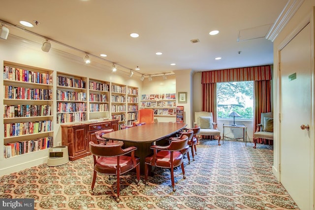 interior space with light carpet, crown molding, and recessed lighting