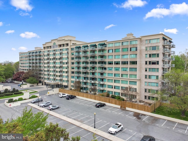 view of property featuring uncovered parking