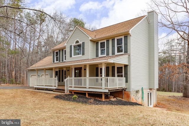 view of front of house with covered porch, a chimney, and roof with shingles