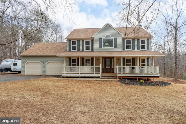 view of front of house featuring driveway, an attached garage, a porch, and roof with shingles