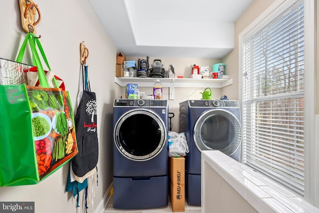 clothes washing area with laundry area and washing machine and clothes dryer