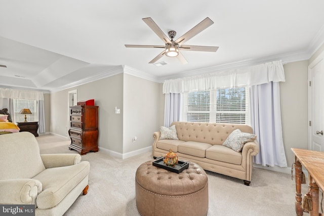 living area with crown molding, a ceiling fan, and light carpet