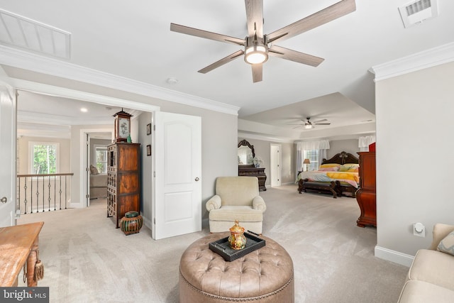 living area with crown molding, baseboards, visible vents, and light carpet