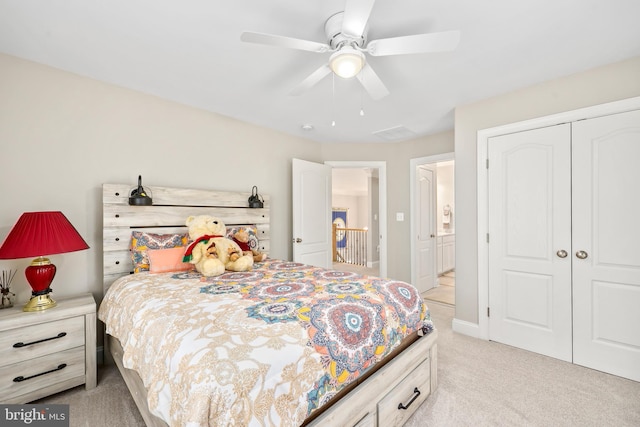 bedroom featuring a closet, light carpet, and ceiling fan