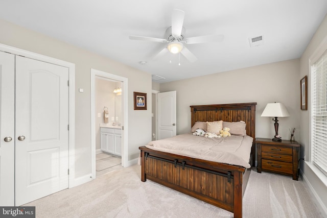 bedroom featuring visible vents, connected bathroom, baseboards, light colored carpet, and ceiling fan