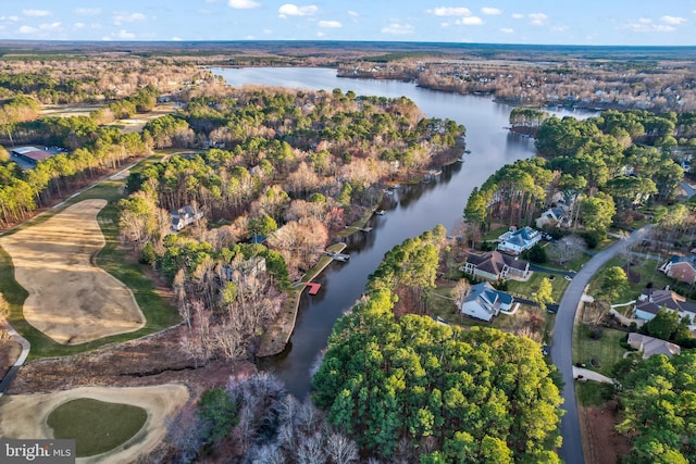 aerial view with a forest view and a water view