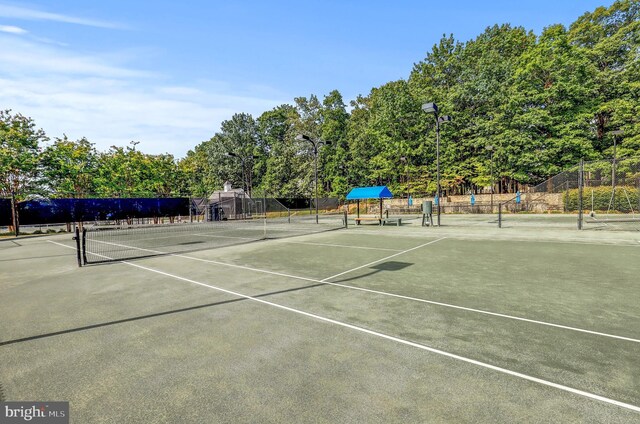 view of sport court featuring fence