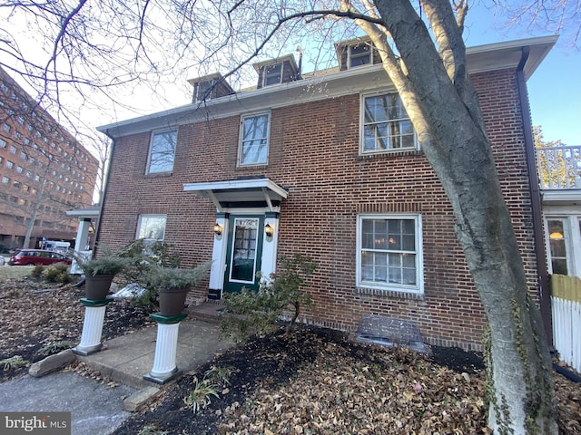 view of front of house featuring brick siding