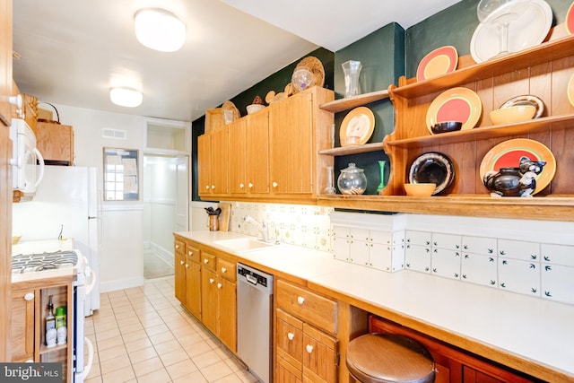 kitchen featuring light tile patterned floors, open shelves, visible vents, a sink, and white appliances