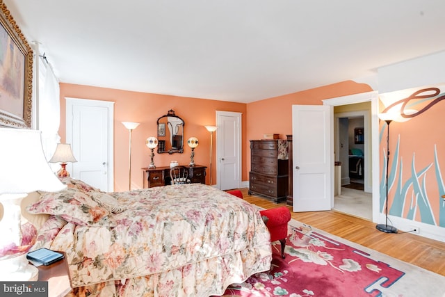 bedroom with light wood-type flooring