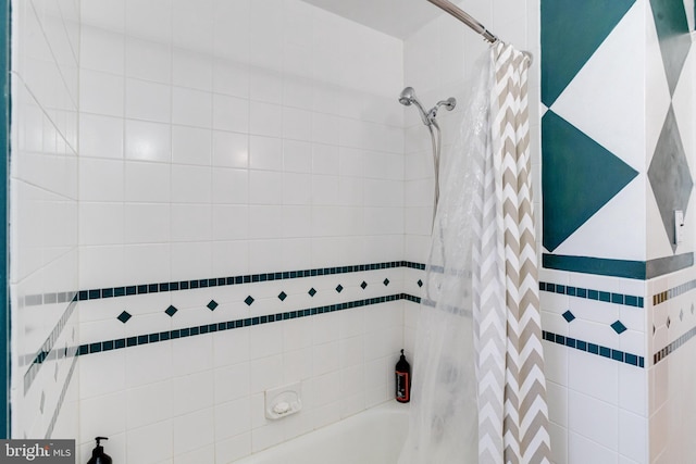 full bathroom with shower / bath combo with shower curtain