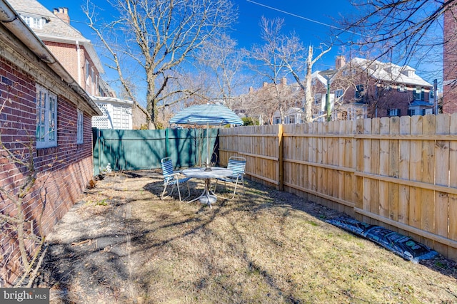 view of yard with a fenced backyard