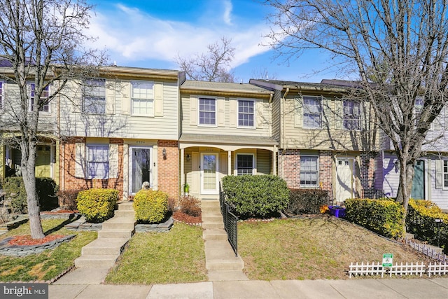 townhome / multi-family property with brick siding