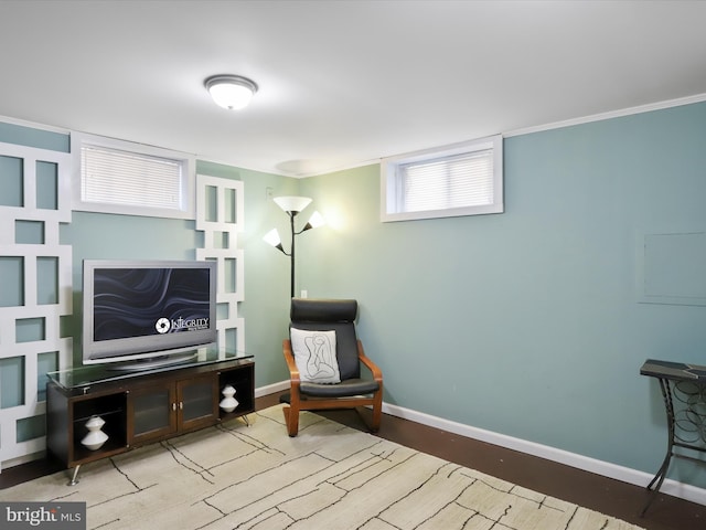 living area with light wood-style floors and baseboards