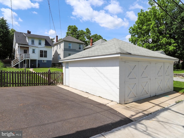 detached garage with fence