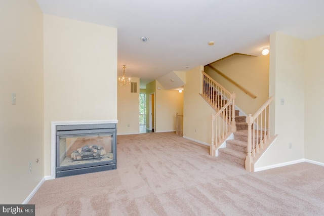 unfurnished living room featuring baseboards, stairway, a multi sided fireplace, and light colored carpet