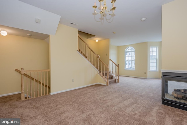 unfurnished living room featuring stairs, carpet, a multi sided fireplace, and baseboards