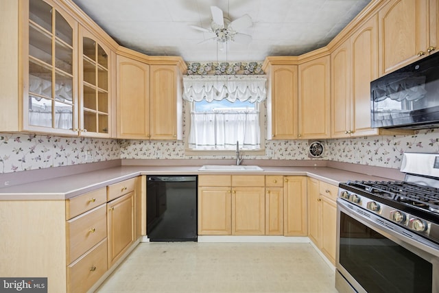 kitchen with glass insert cabinets, light brown cabinets, a sink, and black appliances