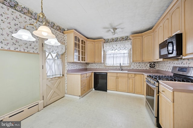 kitchen with baseboard heating, light brown cabinetry, a sink, black appliances, and wallpapered walls