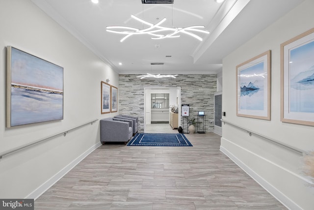 corridor with baseboards, a chandelier, crown molding, and recessed lighting