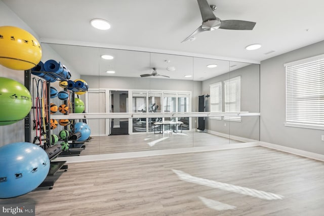 gym with ceiling fan, recessed lighting, light wood-type flooring, and baseboards