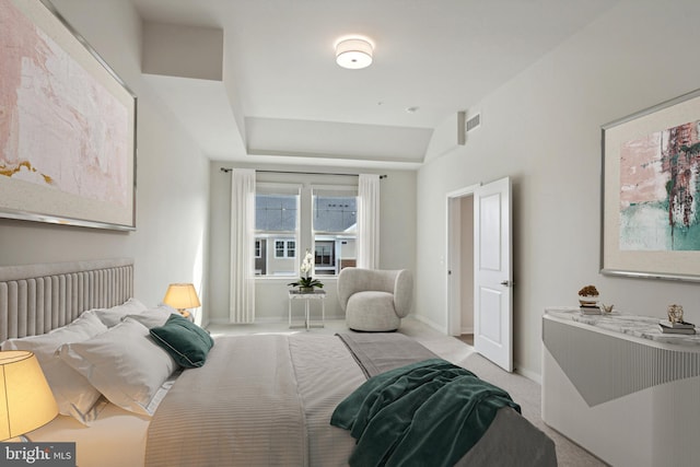 bedroom with lofted ceiling, light colored carpet, visible vents, baseboards, and radiator