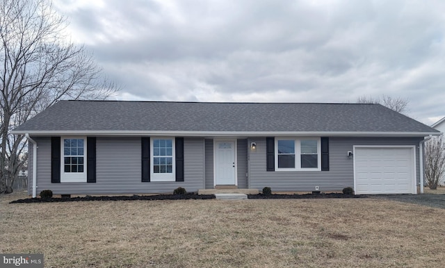 ranch-style house with a front yard, crawl space, roof with shingles, and an attached garage