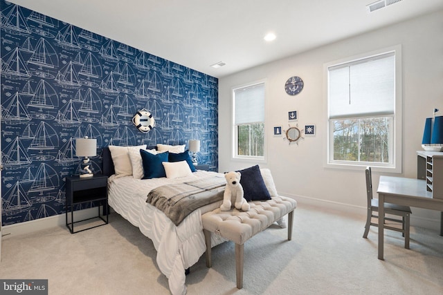 carpeted bedroom with baseboards, multiple windows, and wallpapered walls