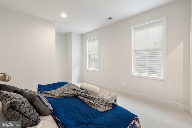 bedroom with baseboards, visible vents, carpet flooring, and recessed lighting