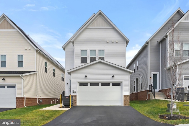 view of front facade featuring central air condition unit, aphalt driveway, a garage, and a front lawn