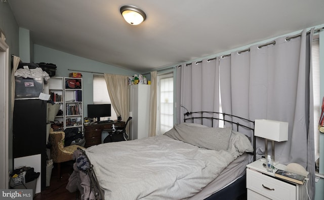 bedroom featuring lofted ceiling