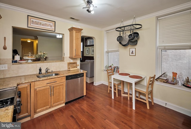 kitchen featuring visible vents, backsplash, ornamental molding, a sink, and dishwasher