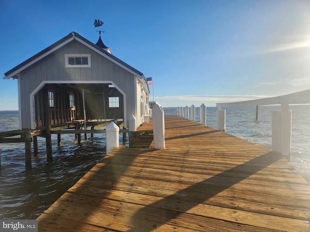 view of dock with a water view and boat lift